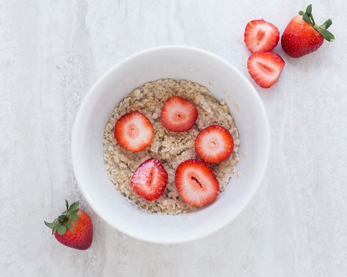 Nutritious balanced meal bowl on a wooden surface